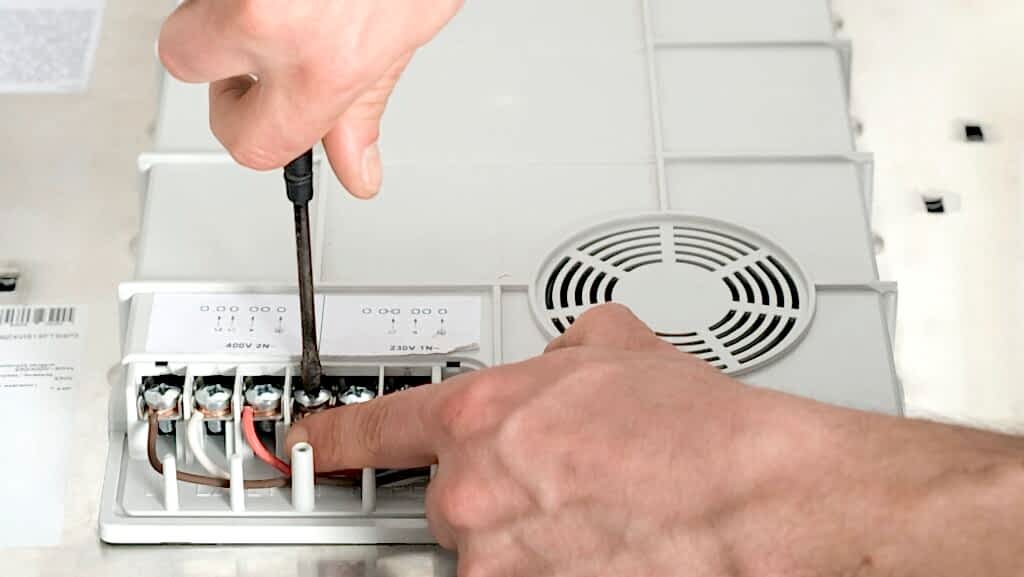 Electrical connection of the induction cooker, contacts, electricity. Electrician, handyman